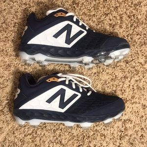 Brand new mens molded baseball cleats.  Size 8.5/New Balance